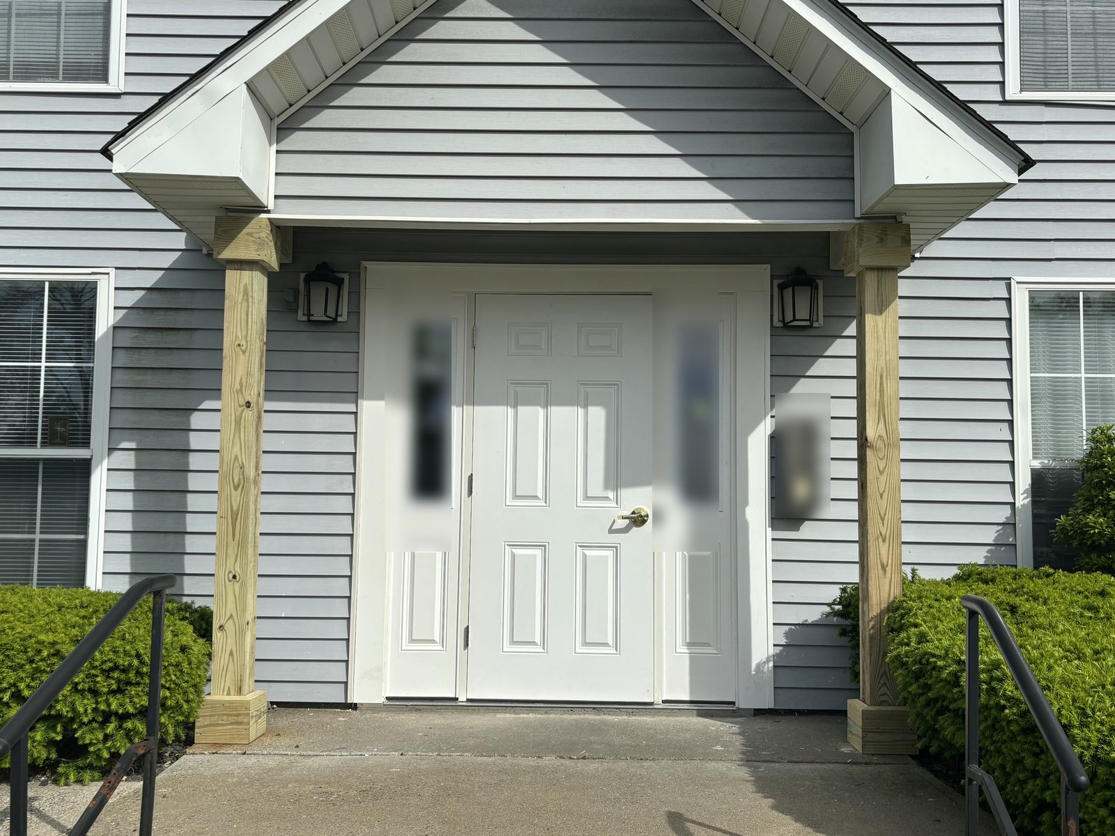 Apartment community entry door with new portico