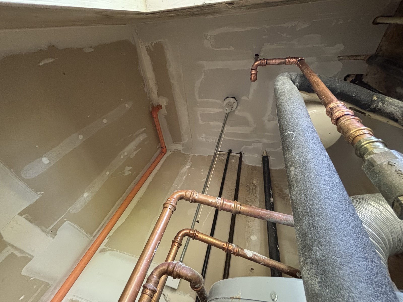Mechanical closet drywall finished clean around copper and ductwork