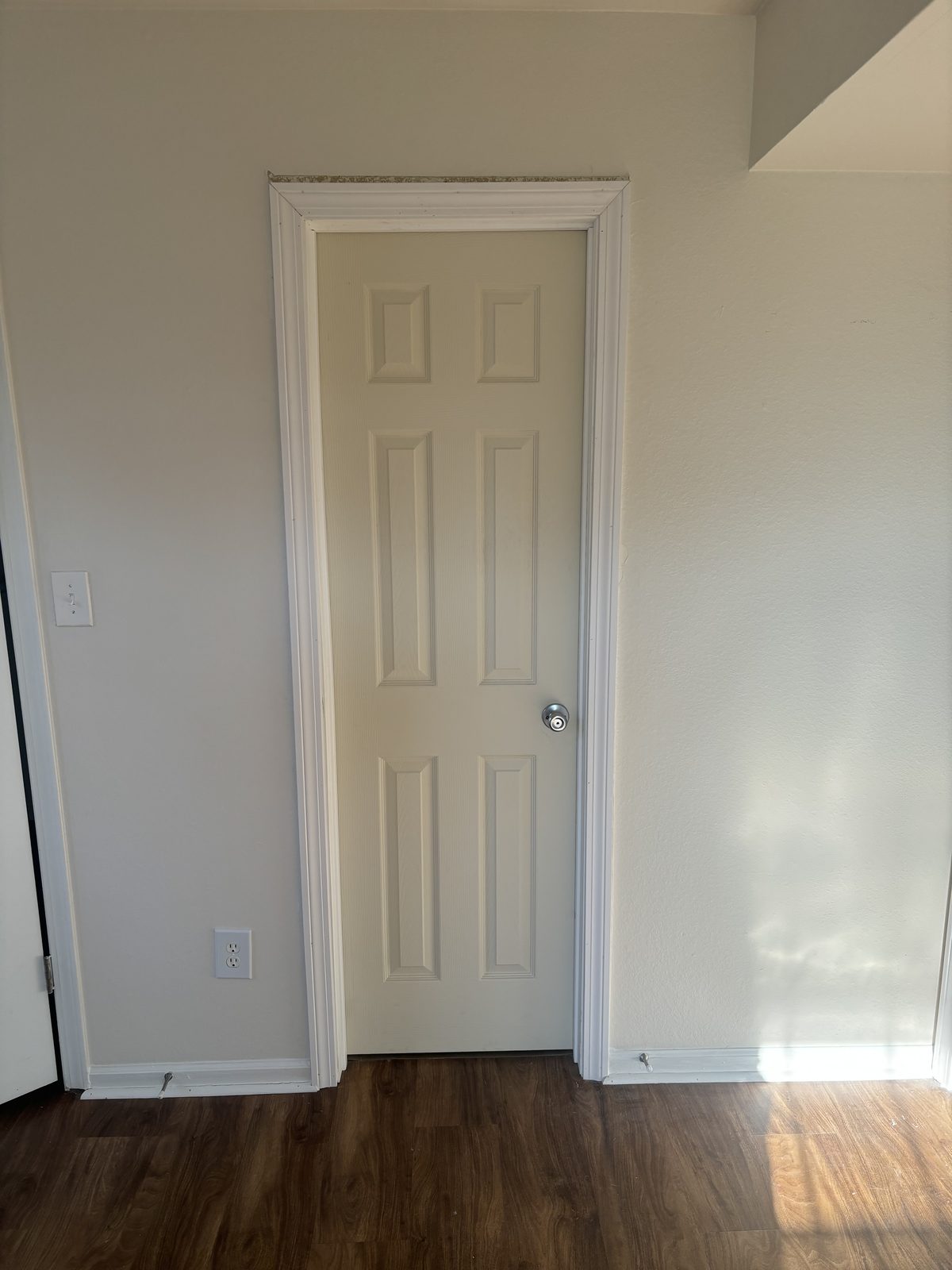 Interior door install on hardwood floor